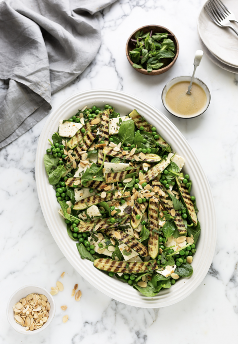 Spinach salad with grilled zucchini, peas, feta & mint
