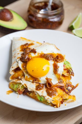 Bacon Jam and Guacamole Quesadilla topped with a Fried Egg and Bacon Jam Vinaigrette Drizzle