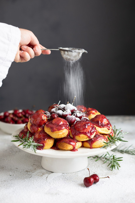 Profiterole wreath with cherries