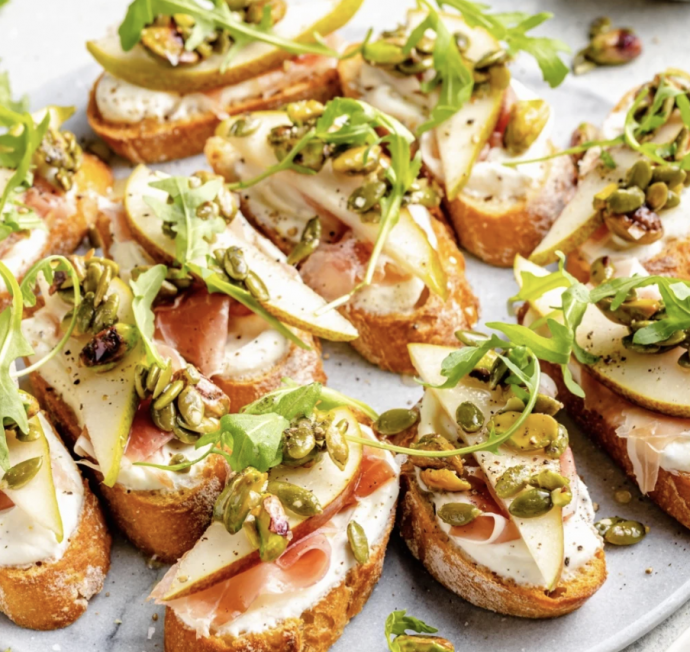 Ricotta and Pear Crostini with Salty Pumpkin Seed Pistachio Crunch